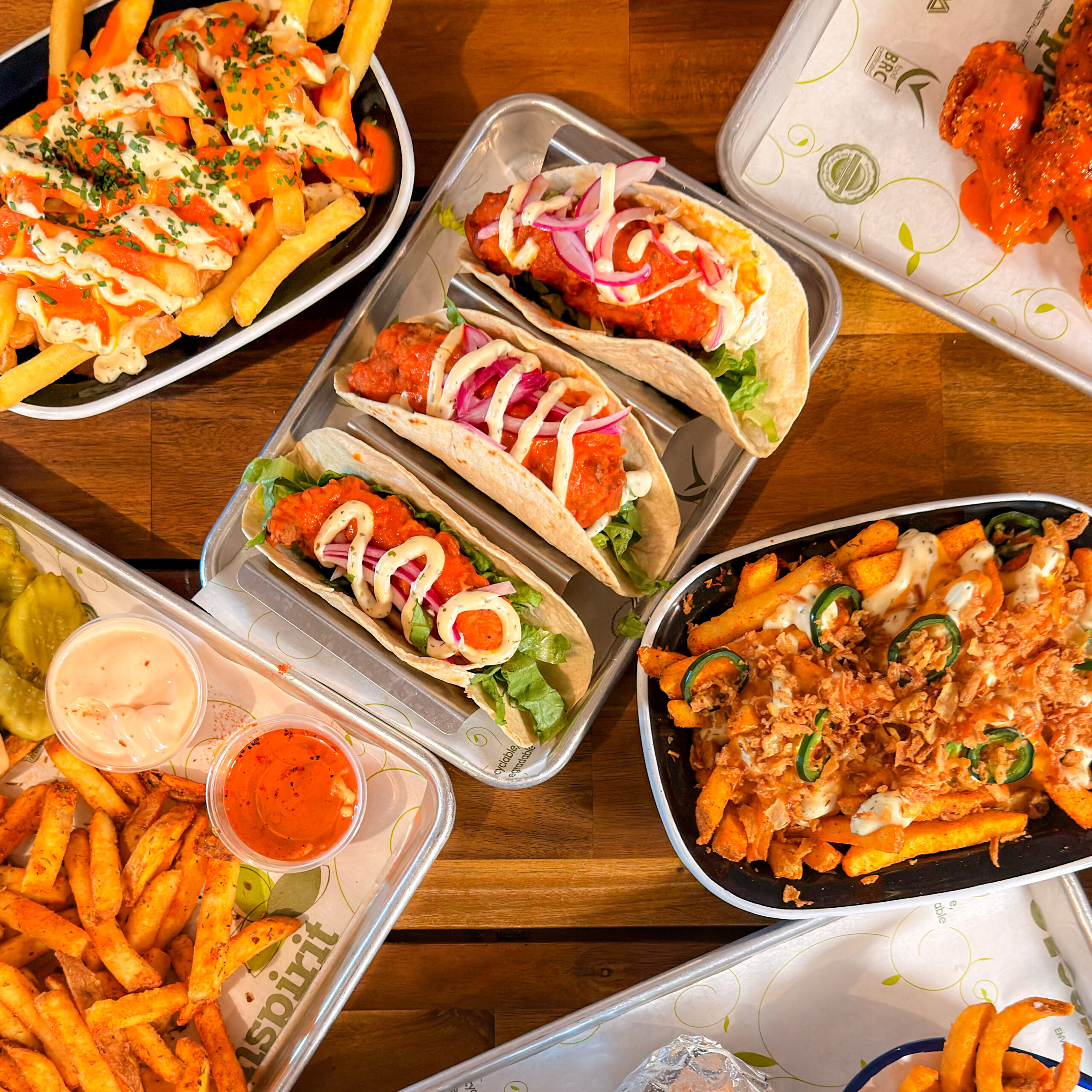 photo of tacos and other menu items on a table